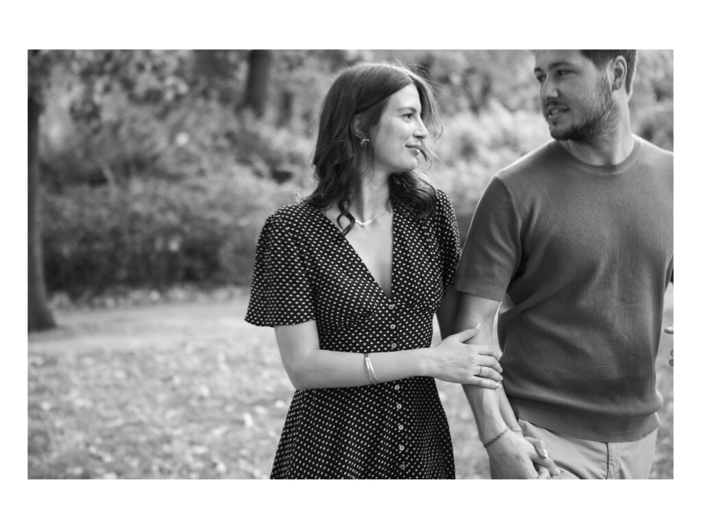 Kristof and Kenza laughing together during their engagement session in Jardin des Plantes Toulouse.