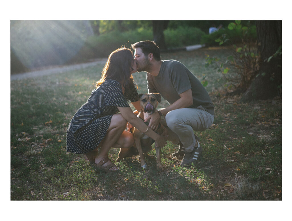 Kristof and Kenza during their engagement session in Toulouse, laughing together in the park before their wedding.