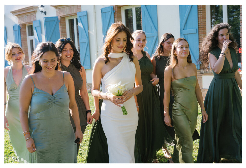 Bride and groom holding hands in vineyard at sunset, Toulouse wedding.