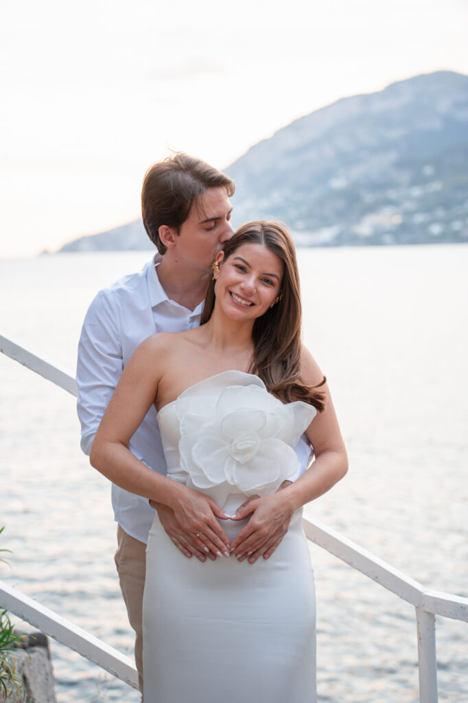 Romantic elopement portrait of a couple by the sea on the Amalfi Coast at sunset